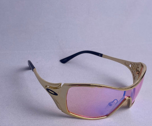 Óculos Okley Dourado Com Rosa